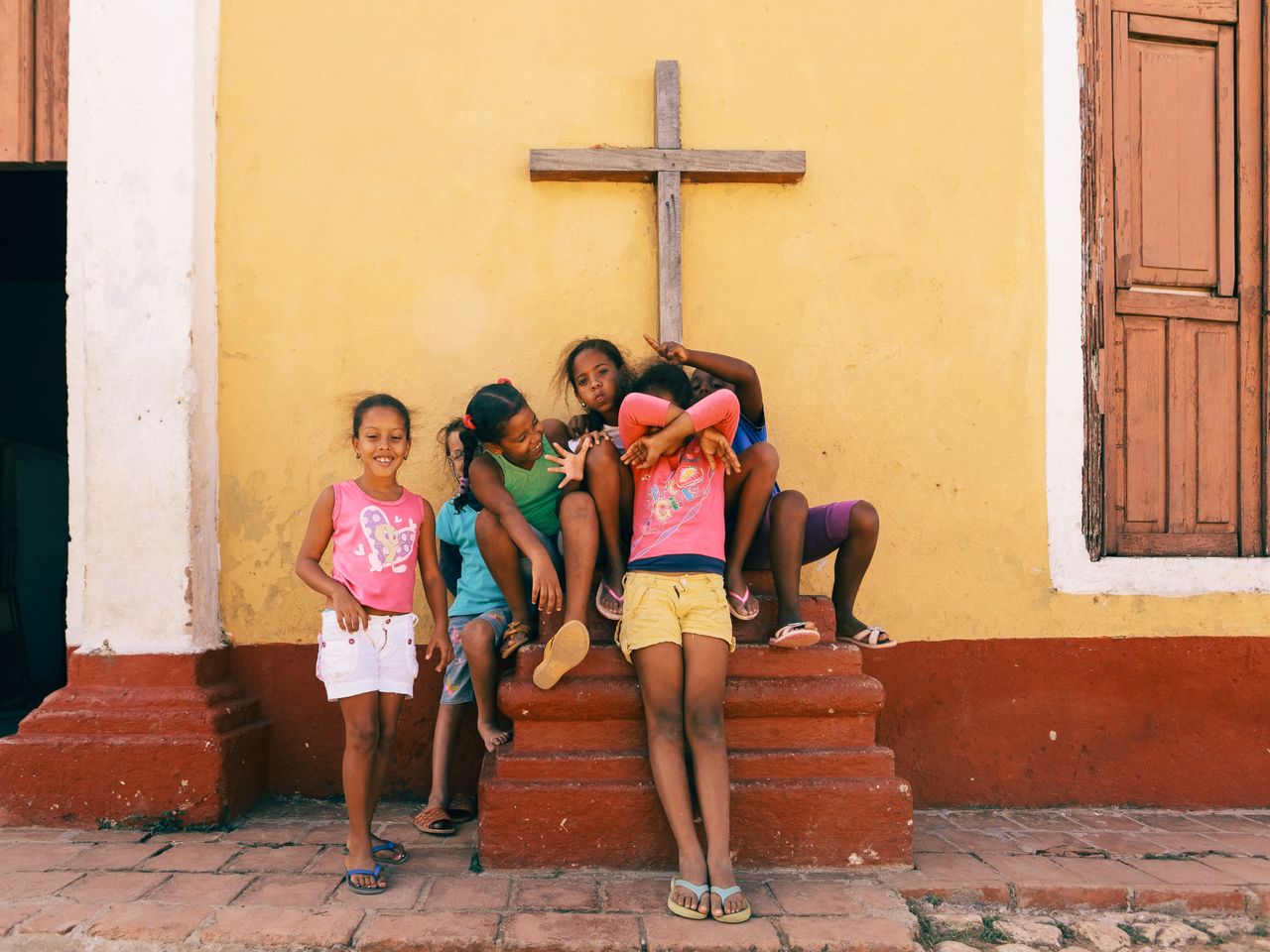 A group of cheerful children gathered outdoors, celebrating community and friendship