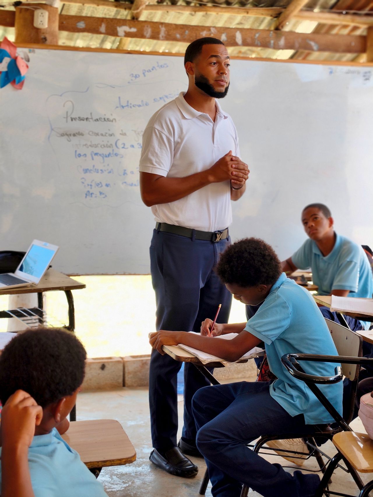 Teacher actively guiding and engaging students during a classroom lesson